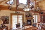 Antler Lodge - Living room/dinning room with gas fireplace. 